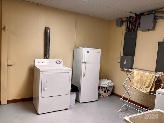 clothes washing area with electric panel and washing machine and clothes dryer