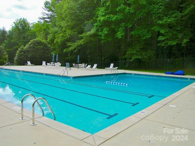 view of pool featuring a patio