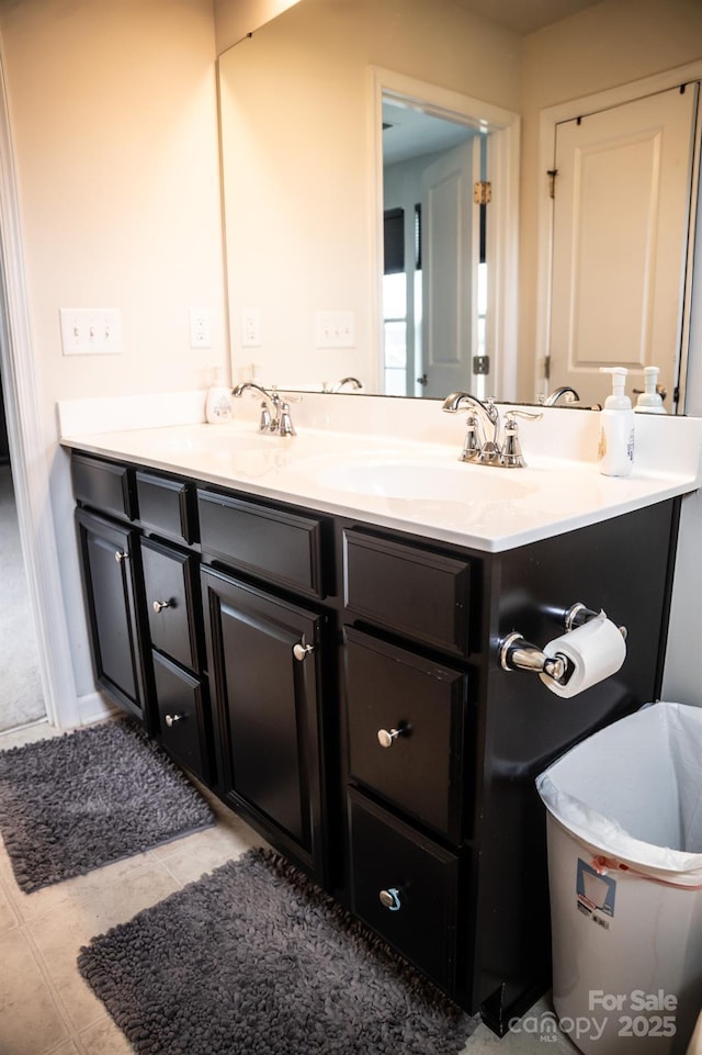 bathroom featuring tile patterned flooring and vanity