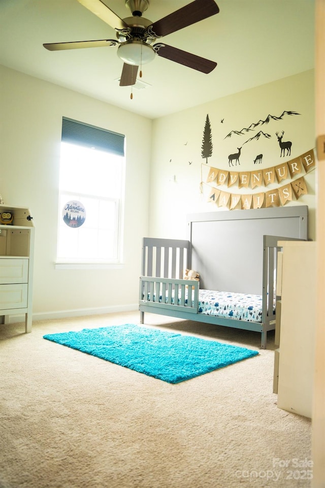 unfurnished bedroom featuring ceiling fan and carpet floors