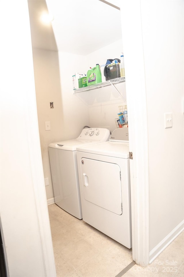 washroom featuring washer and clothes dryer