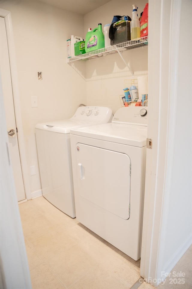 laundry area with washing machine and clothes dryer