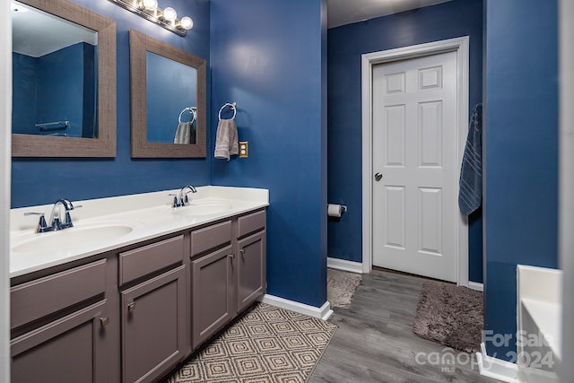 bathroom featuring hardwood / wood-style floors and vanity