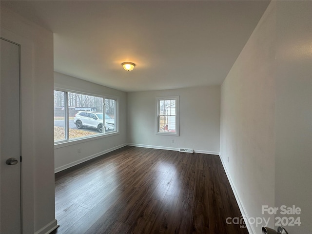 empty room featuring dark hardwood / wood-style floors