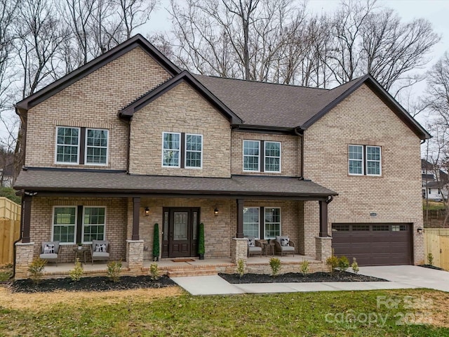 craftsman-style house featuring a porch and a garage