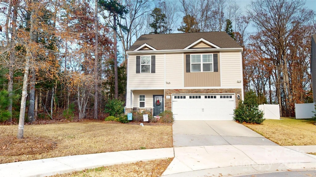 view of front facade featuring a front lawn and a garage