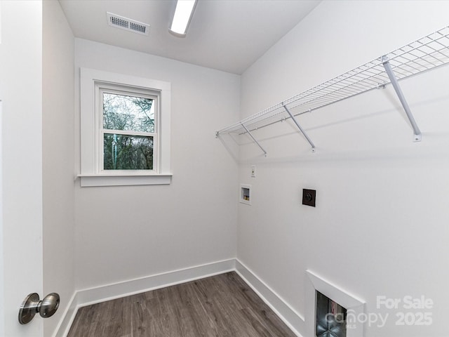 washroom with visible vents, dark wood-type flooring, baseboards, laundry area, and hookup for a washing machine