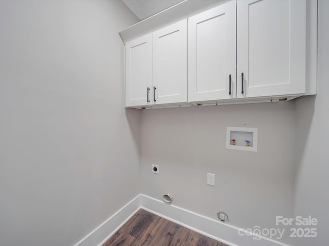 laundry area with cabinets, hookup for a washing machine, dark wood-type flooring, electric dryer hookup, and hookup for a gas dryer