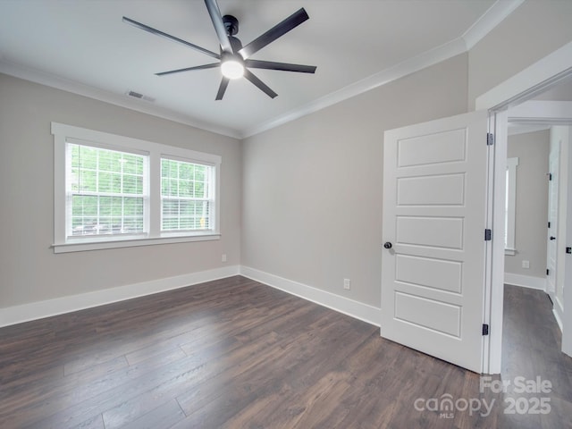 spare room with dark hardwood / wood-style floors, ceiling fan, and crown molding