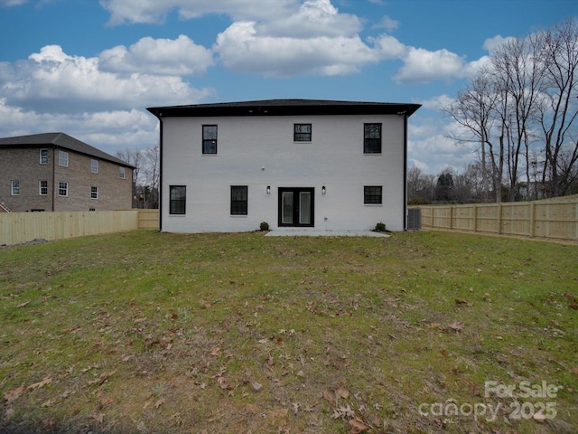 back of house with a yard