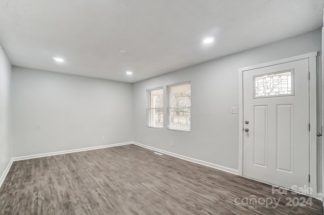 entryway with a healthy amount of sunlight and dark wood-type flooring