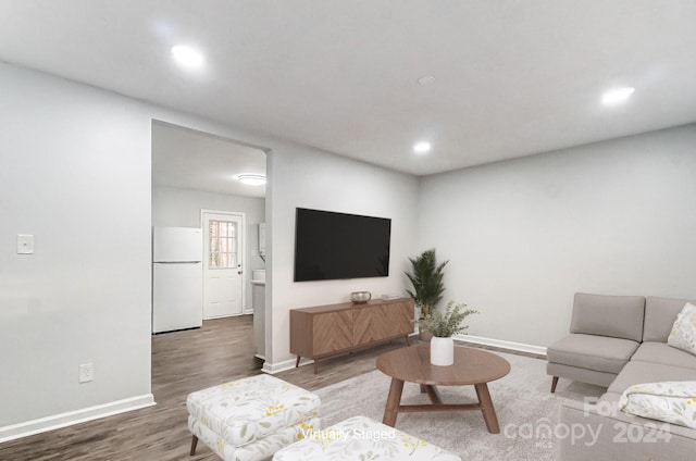 living room with dark hardwood / wood-style flooring