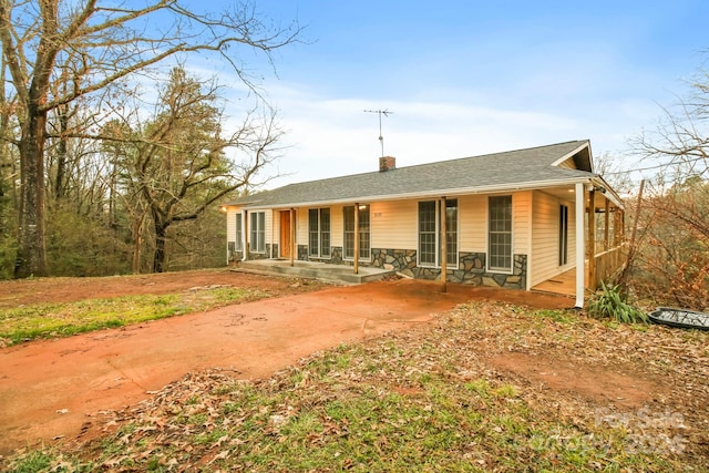 single story home with covered porch