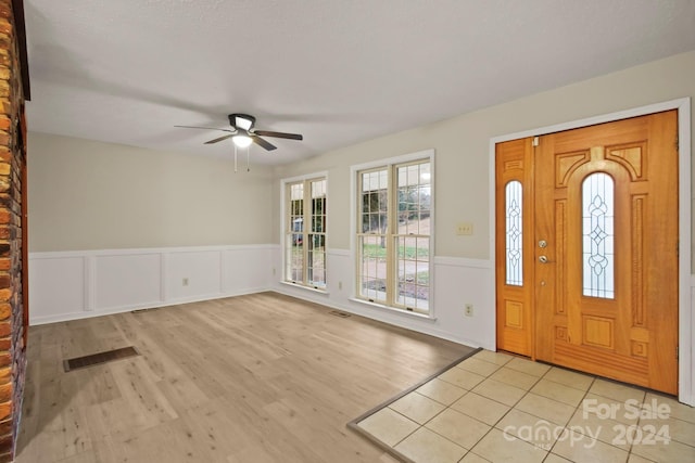 entrance foyer with light hardwood / wood-style floors and ceiling fan