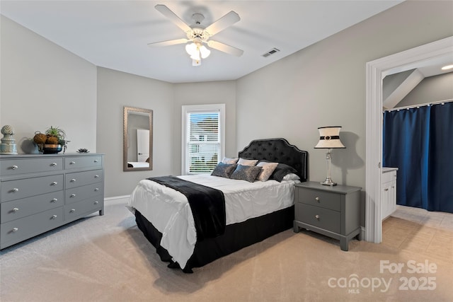 bedroom featuring light colored carpet and ceiling fan