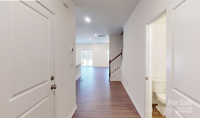 corridor with dark wood-type flooring