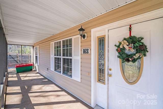 property entrance with covered porch