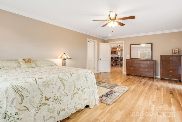 bedroom with ceiling fan, light hardwood / wood-style flooring, and crown molding