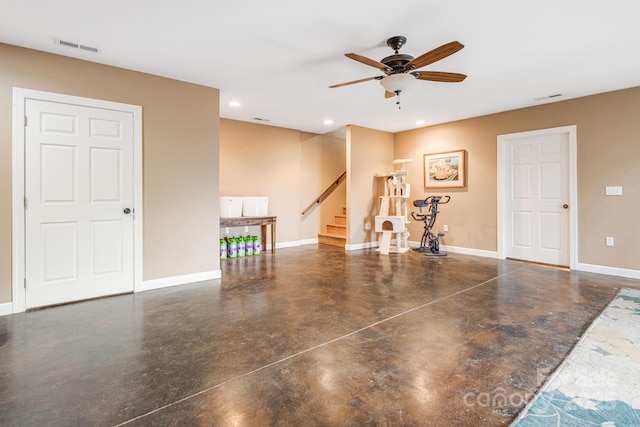 interior space with ceiling fan