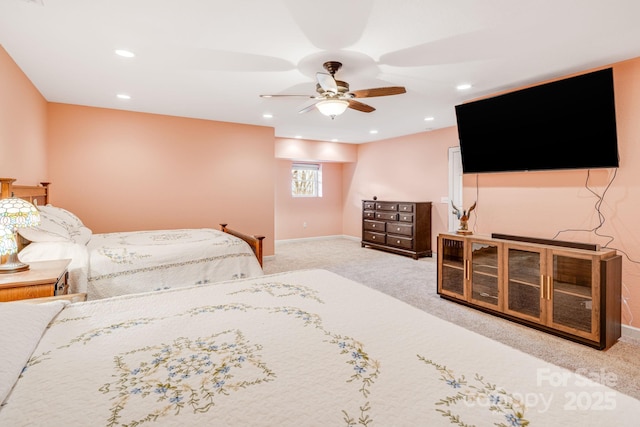 bedroom featuring light colored carpet and ceiling fan