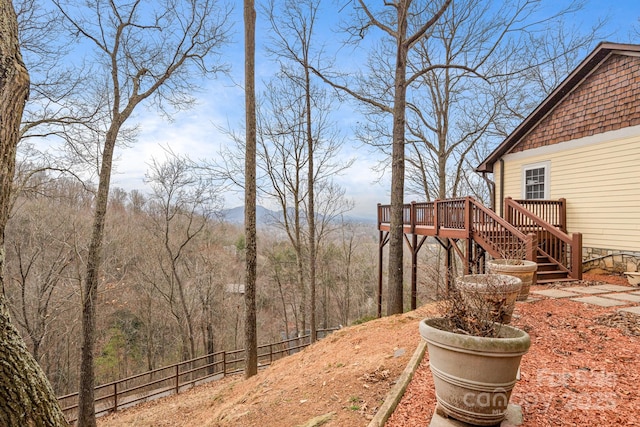 view of yard featuring a wooden deck