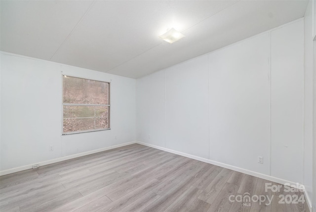 empty room with light wood-type flooring