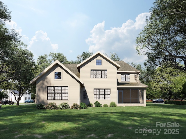 rear view of property with a sunroom and a lawn