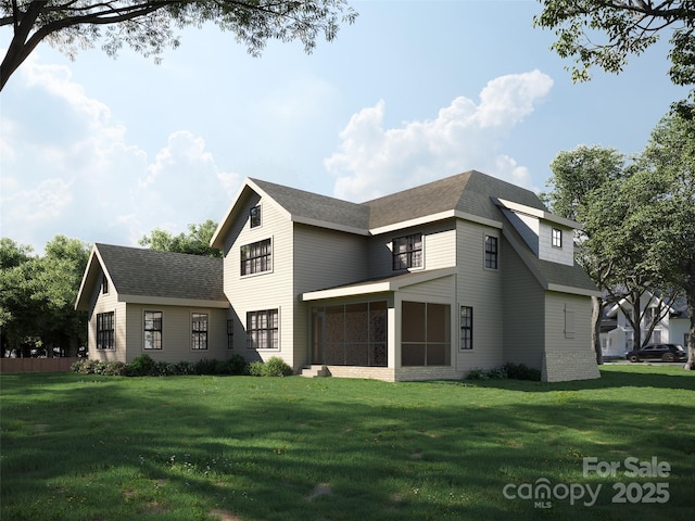 back of property with a sunroom, a shingled roof, and a yard