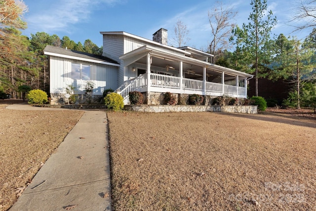 view of front of home with a porch and ceiling fan