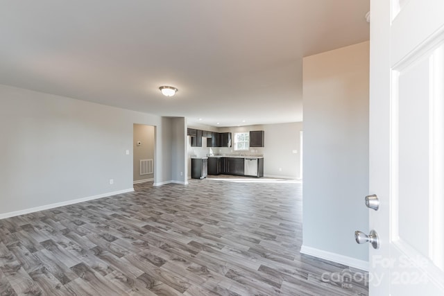 unfurnished living room featuring light wood-type flooring