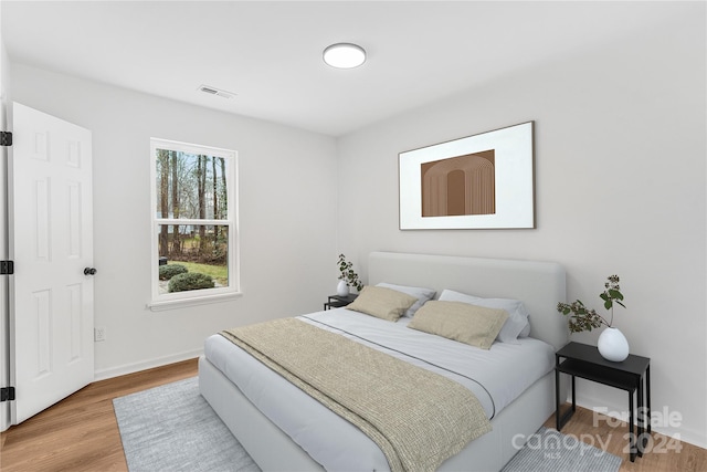 bedroom featuring hardwood / wood-style flooring