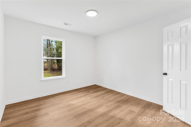 spare room with light wood-type flooring