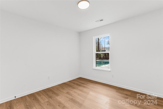 unfurnished room featuring light wood-type flooring