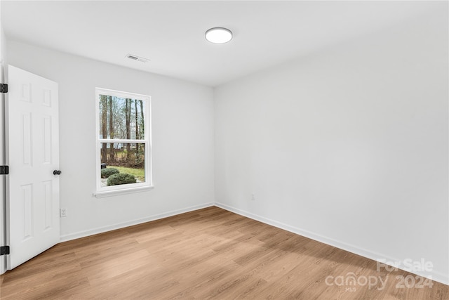 spare room featuring light hardwood / wood-style flooring