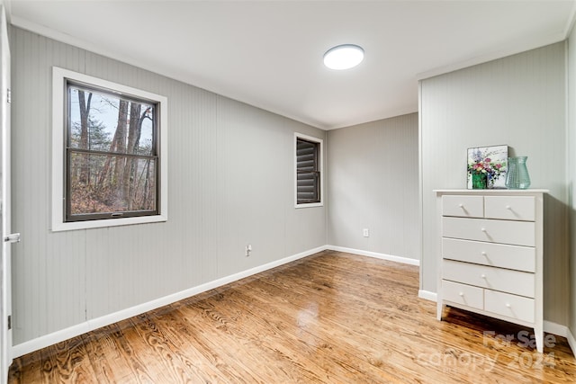 unfurnished bedroom with light wood-type flooring