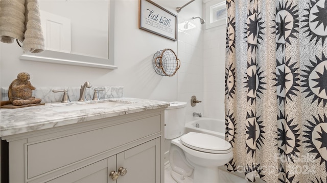 full bathroom with vanity, shower / bath combination with curtain, and toilet