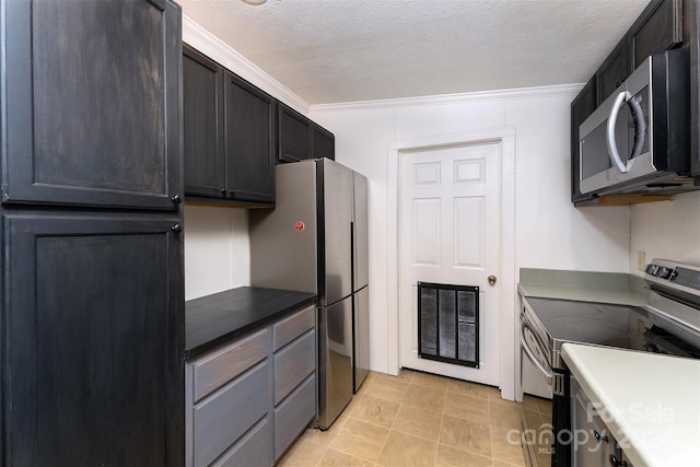 kitchen featuring a textured ceiling, crown molding, and stainless steel appliances