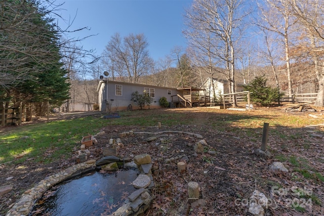 view of yard featuring a wooden deck