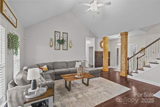 living room with ornate columns, ceiling fan, dark hardwood / wood-style flooring, and high vaulted ceiling