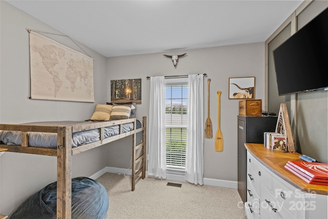 bedroom with light carpet