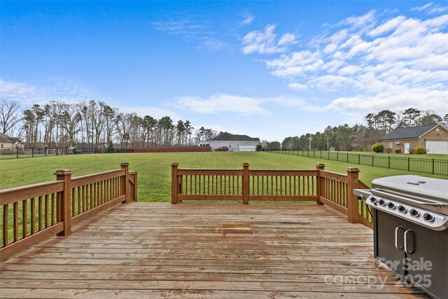 wooden deck with a lawn