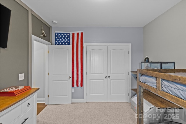 carpeted bedroom with a closet