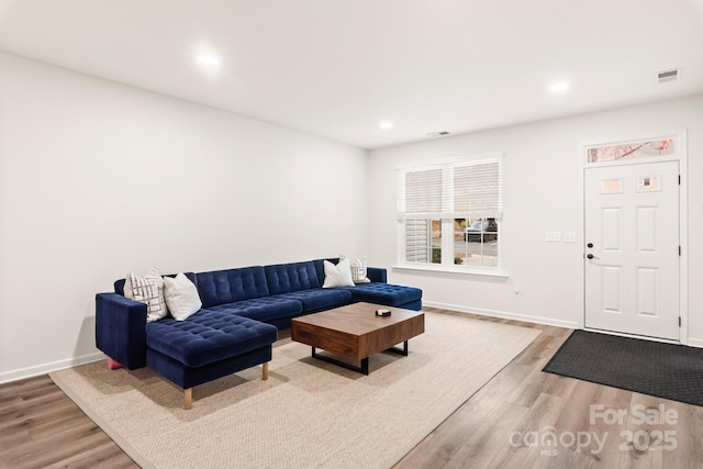 living room with light hardwood / wood-style floors