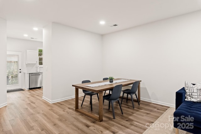 dining room featuring light hardwood / wood-style floors