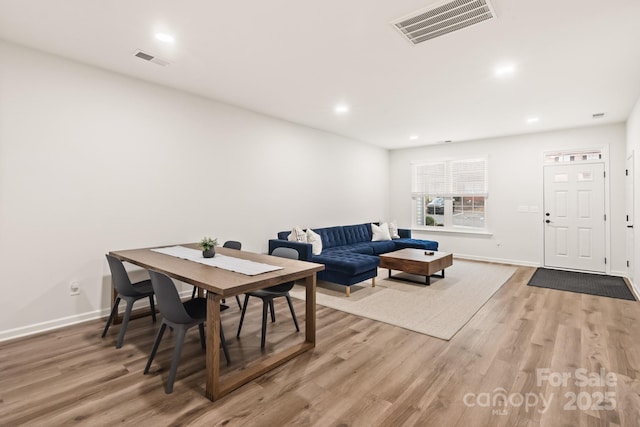 dining area with hardwood / wood-style floors