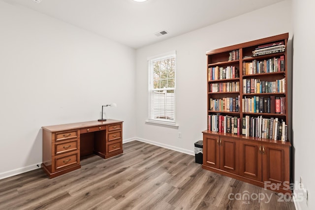 office area with wood-type flooring