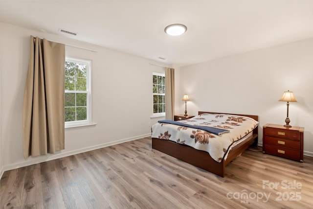 bedroom with light hardwood / wood-style floors