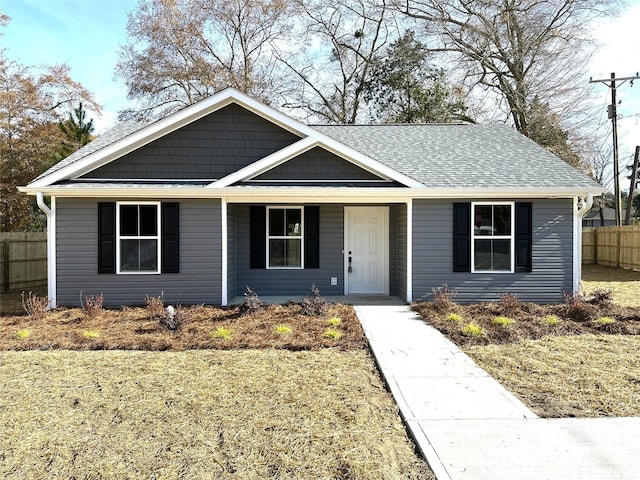 view of front of home featuring a porch and a front lawn