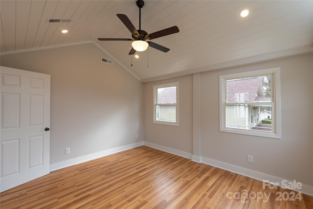 unfurnished room featuring lofted ceiling, ceiling fan, light wood-type flooring, and wood ceiling