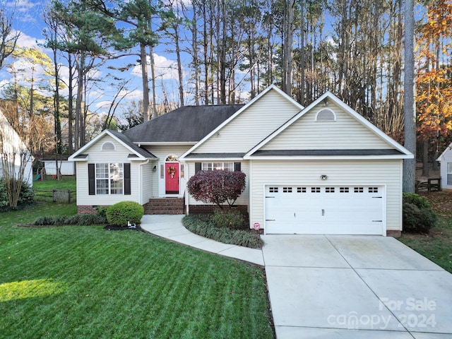 single story home with a front yard and a garage